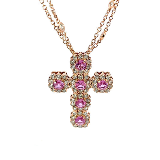 18K ROSE GOLD PINK SAPPHIRE AND DIAMOND CROSS CONATAINING 6 ROUND PS TOTALING 2.02CT EACH SURROUNDED BY A CUSHION SHAPED DIAMOND HALO SET ON A DOUBLE ROW DIAMOND CHAIN DIAMONDS TOTAL 2.93CT