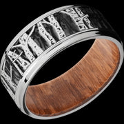 9 mm wide/Flat Grooved Edges/Cobalt Chrome band with a laser carved Aspen pattern also featuring a Leopard Wood sleeve.