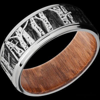 9 mm wide/Flat Grooved Edges/Cobalt Chrome band with a laser carved Aspen pattern also featuring a Leopard Wood sleeve.