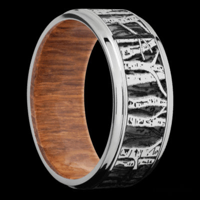 9 mm wide/Flat Grooved Edges/Cobalt Chrome band with a laser carved Aspen pattern also featuring a Leopard Wood sleeve.