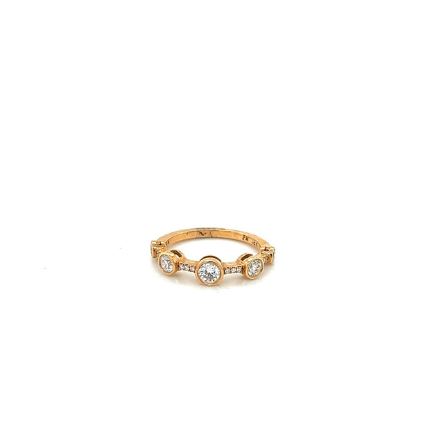 18k rose gold graduated bezel diamond band containing 17 round diamonds totaling 0.60ct